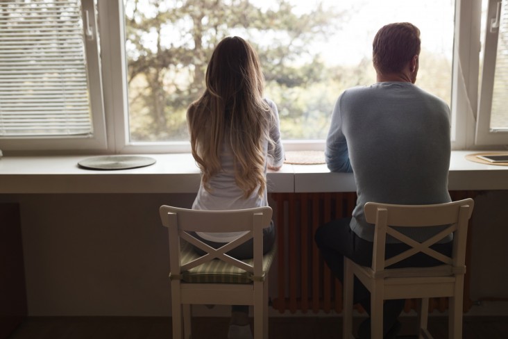 Couple look out window