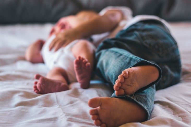 Parent and kid on the bed